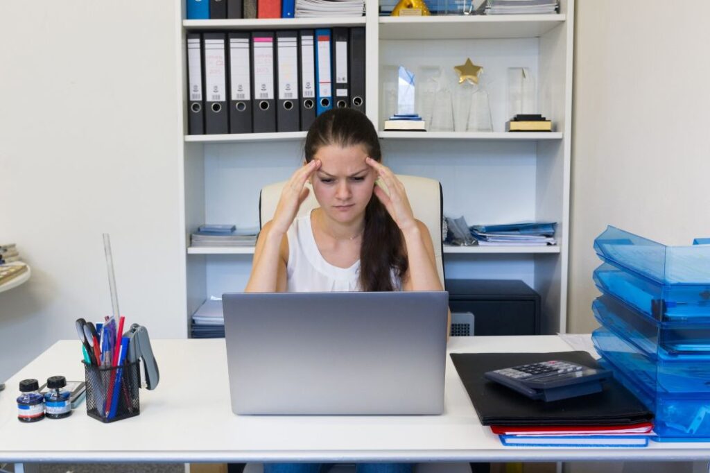 portrait of young woman working in the office 